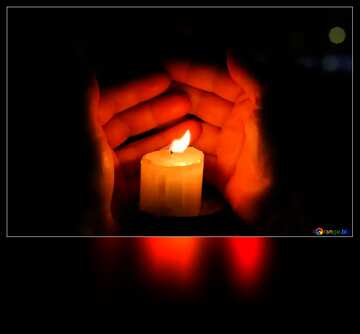 FX №121656 wind protecting a candle flame with two hand
