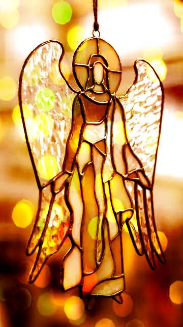 FX №146687 Stained glass. Angel of colored glass sepia toned bokeh background