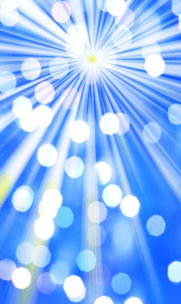 Rays of sunlight blue bokeh background