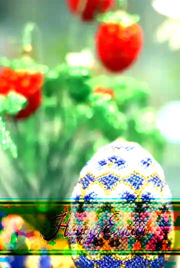 FX №169702 Easter egg decorated with beads on the background of flowers Inscription Happy Easter on bokeh...