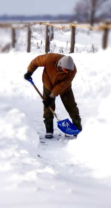 FX №180067  Man  removes  snow  shovel