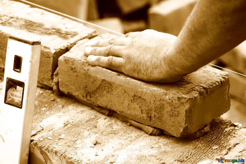 Mason building brick wall hand on brick №2956