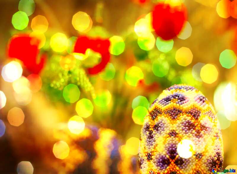 Easter egg decorated with beads on the background of flowers Bokeh Background №49165