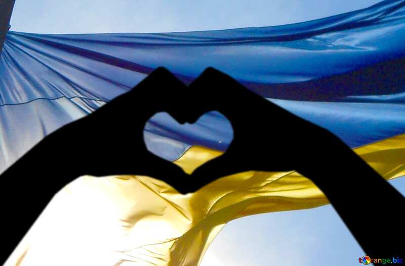 a flag Ukraine in the sky hands and heart silhouette №51268