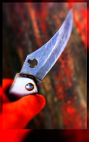 FX №264633 Sharp Elegance: Captivating Close-Up of a Silver Folding Knife