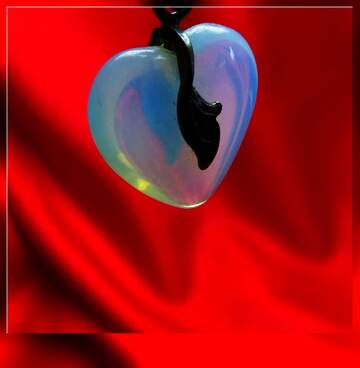 FX №268018 Glowing Heart Pendant on Red Silk Background - Captivating Jewelry Art